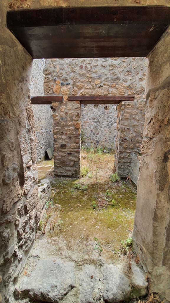 I.11.16 Pompeii. July 2021. 
Looking south through doorway into room 10 at east end of south wall, leading into a room with two doorways.
Foto Annette Haug, ERC Grant 681269 DÉCOR.
