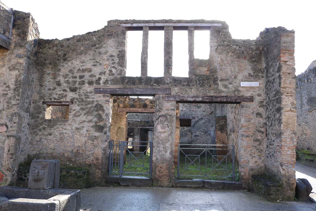 I.12.2 and I.12.1 Pompeii. December 2018. Looking south to entrances on Via dellAbbondanza. Photo courtesy of Aude Durand.