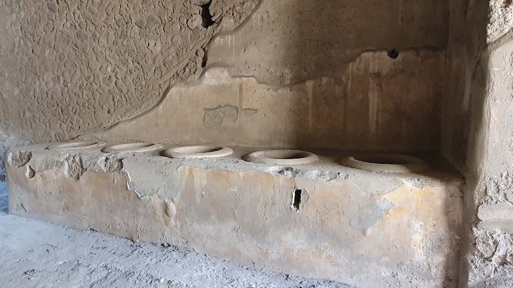 I.12.3 Pompeii, December 2018. 
Looking west across room 1, towards counter leaning against west wall of courtyard. Photo courtesy of Aude Durand.
