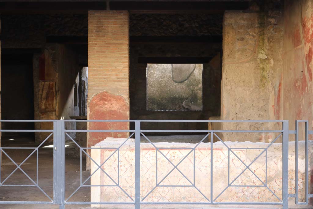 I.12.3 Pompeii. September 2015. Graffiti on the wall to west of door, without the benefit of a dirty piece of plastic sheeting.