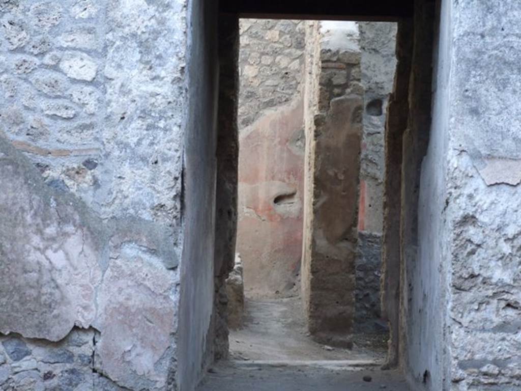 I.12.5 Pompeii. December 2007. Looking south through corridor to rear rooms and garden.
According to Jashemski, this property appeared to have had an open area, which may have been planted. This would have been to the rear of the living quarters. See Jashemski, W. F., 1993. The Gardens of Pompeii, Volume II: Appendices. New York: Caratzas. (p.54)
