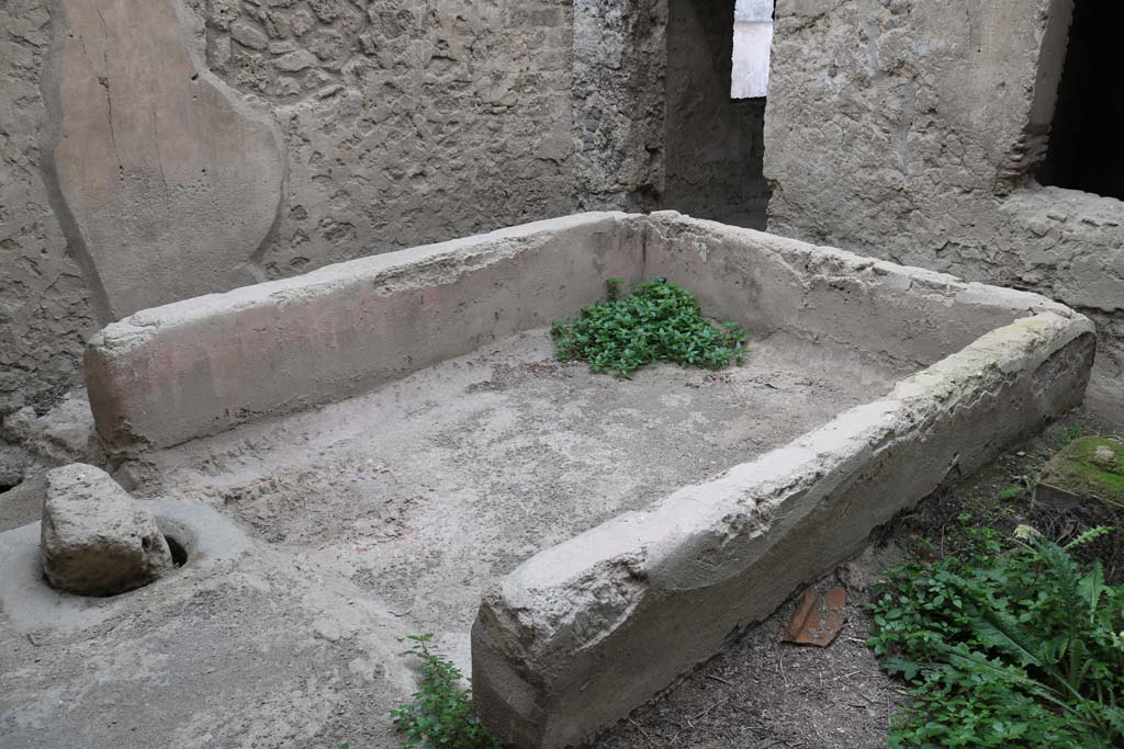 I.12.5 Pompeii. December 2018. 
Looking north-west across basin/tub towards north wall with doorway to corridor and window to triclinium. Photo courtesy of Aude Durand.
