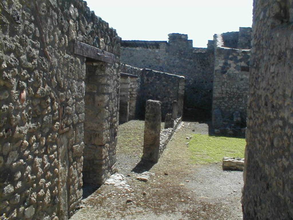 I.12.6 Pompeii. May 2005. Looking west from entrance towards portico and peristyle area.