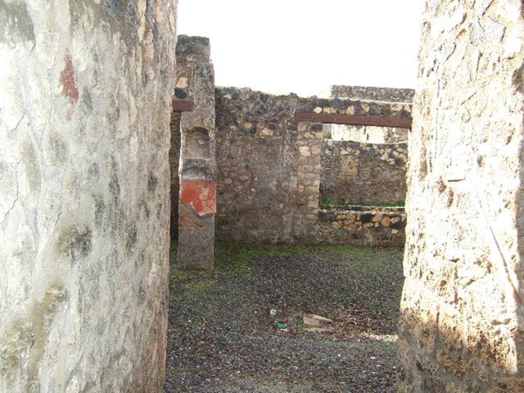 I.12.7 Pompeii.  December 2005.  Looking west from entrance, through window to garden area.