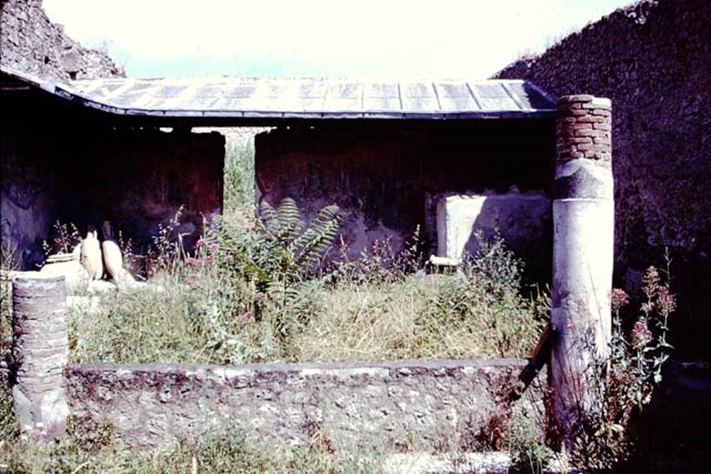 I.12.8 Pompeii, 1978. Looking north across peristyle from south portico with remains of two columns. Photo by Stanley A. Jashemski.   
Source: The Wilhelmina and Stanley A. Jashemski archive in the University of Maryland Library, Special Collections (See collection page) and made available under the Creative Commons Attribution-Non Commercial License v.4. See Licence and use details.
J78f0207

