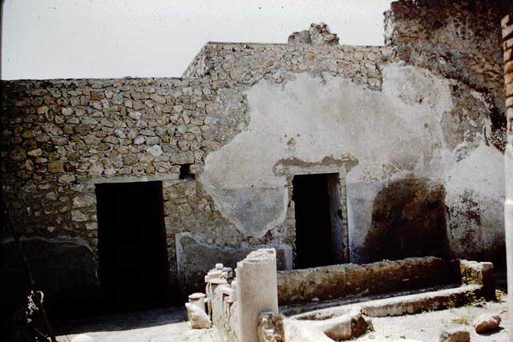 I.12.8 Pompeii. 1961. Looking towards west side of peristyle garden, and doorways to rooms 10 and 11. Photo by Stanley A. Jashemski.
Source: The Wilhelmina and Stanley A. Jashemski archive in the University of Maryland Library, Special Collections (See collection page) and made available under the Creative Commons Attribution-Non Commercial License v.4. See Licence and use details.
J61f0554
