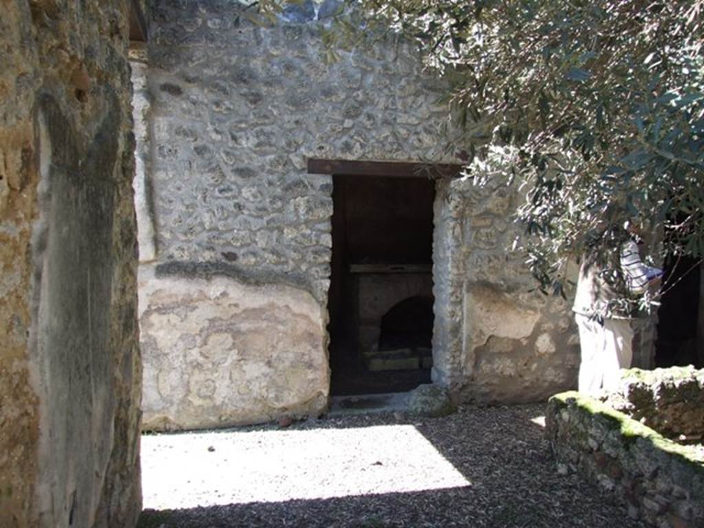 I.12.8 Pompeii.  March 2009.   West side of south portico, with doorway to room 10.