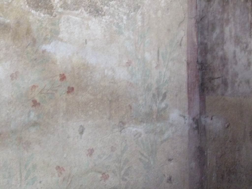 I.12.8 Pompeii.  March 2009. Room 10. West wall.  Lararium. Remains of painted plant decoration.