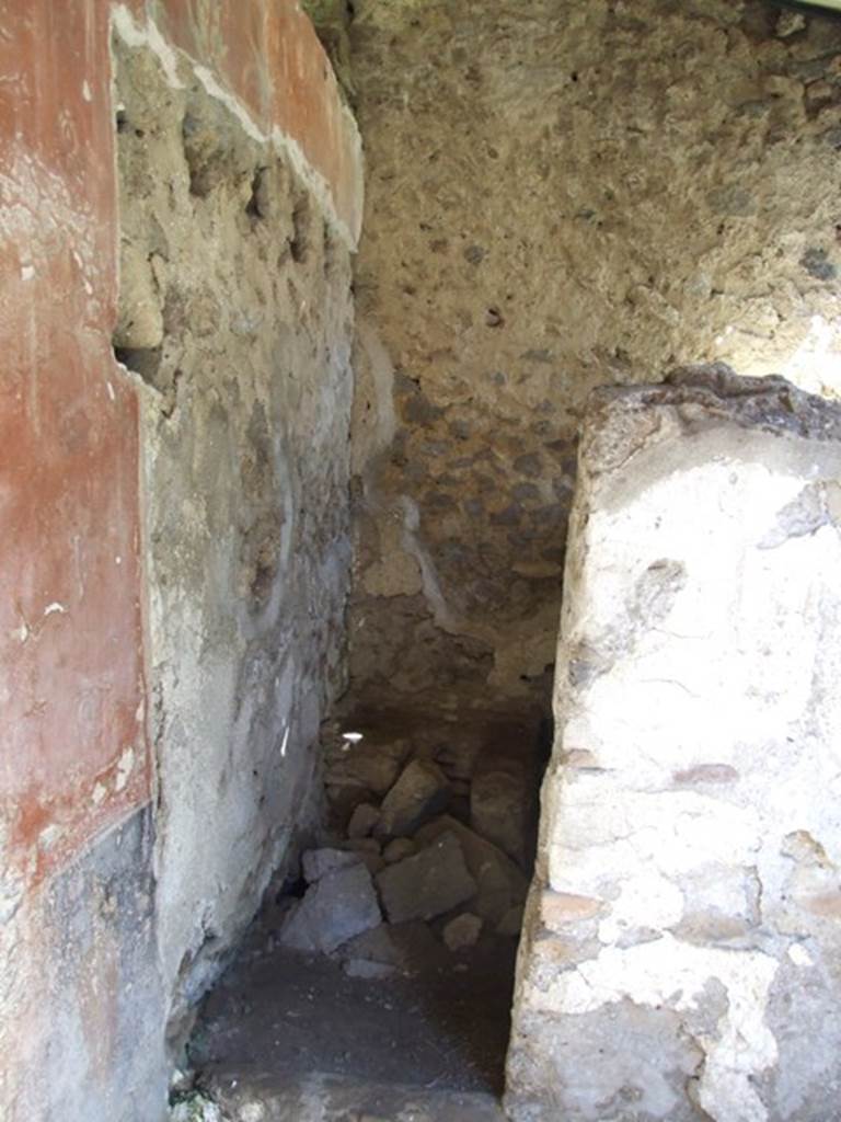 I.12.8 Pompeii.  March 2009.   Room 9.  North east corner of peristyle garden. Doorway to room 12.