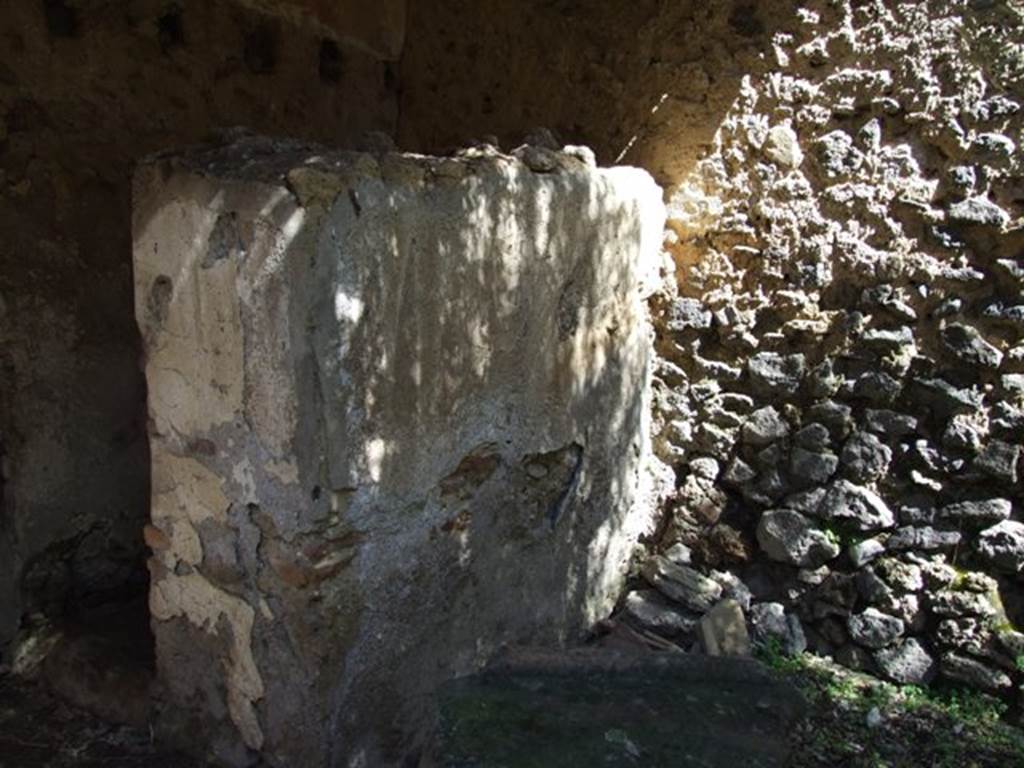 I.12.8 Pompeii. March 2009. Room 9, north-east corner, looking towards dividing wall with room 12, latrine. This latrine was probably added for the workers, when the house was converted into a garum shop.
