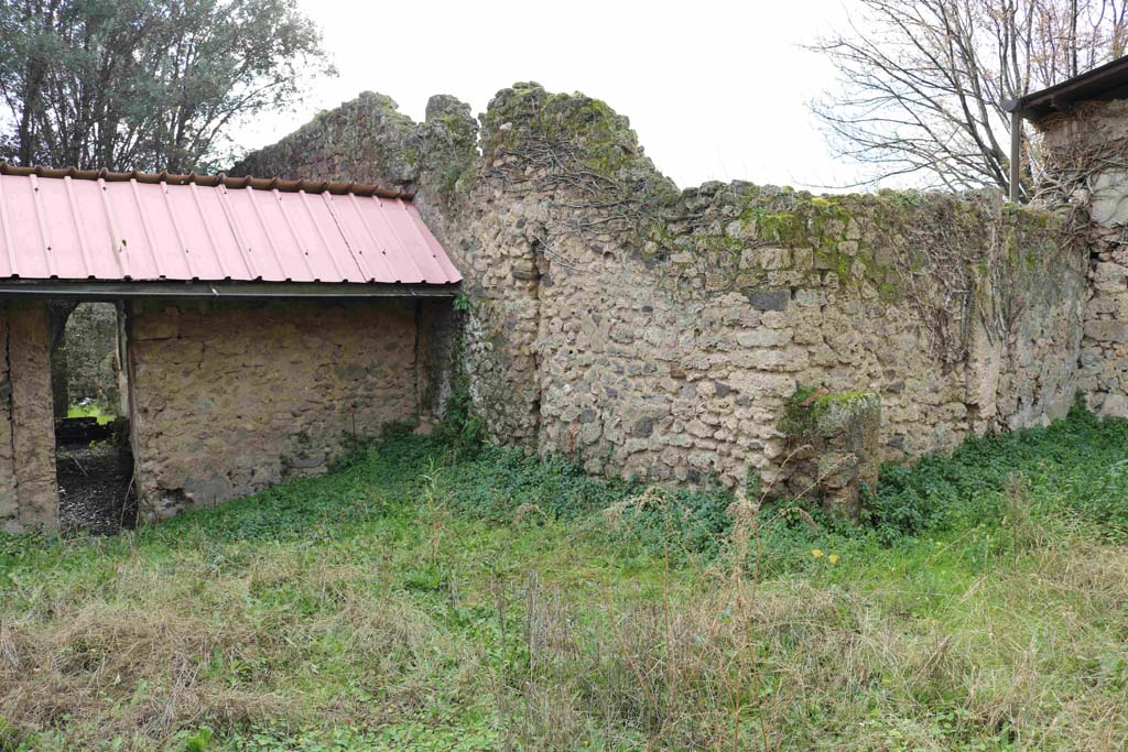 I.12.8 Pompeii. December 2018. 
Room 13, looking towards south wall, with doorway to room 9 peristyle garden, and south-west corner, on right. Photo courtesy of Aude Durand.
