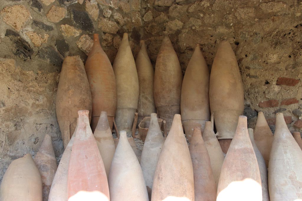 I.12.8 Pompeii. October 2022. Room 13, detail of amphorae. Photo courtesy of Klaus Heese.