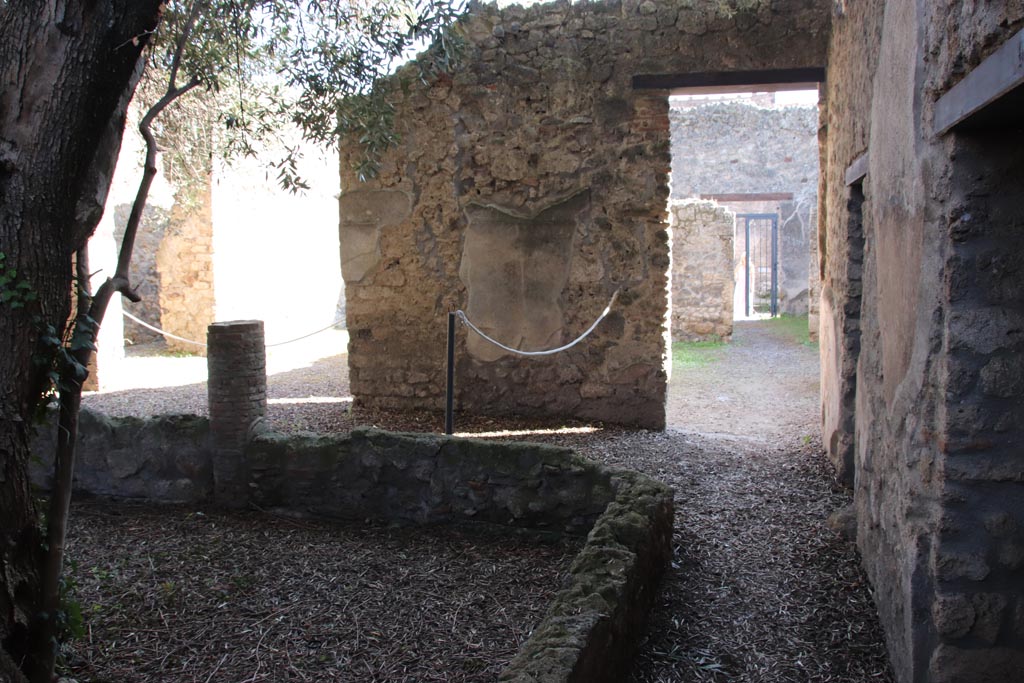 I.12.8 Pompeii. October 2022. 
Peristyle 9, looking south along west side towards doorway to 5, on right, and into room 7 on south portico, on left.
Photo courtesy of Klaus Heese.

Photo courtesy of Klaus Heese.
