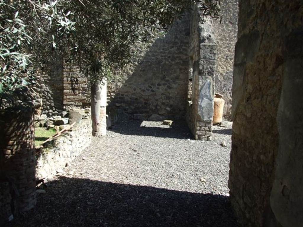 I.12.8 Pompeii.  March 2009.   Looking east across south portico, with columns in low wall to support roof of portico.