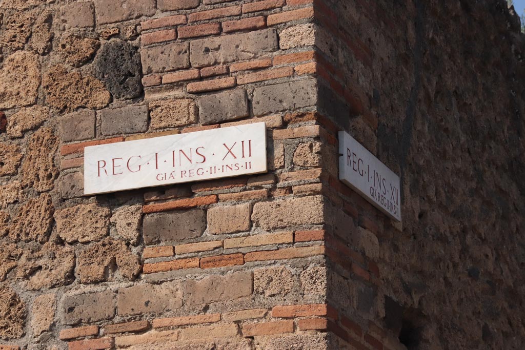 I.12.8 Pompeii. October 2023. Insula identification plaque, originally known as II.2. Photo courtesy of Klaus Heese.