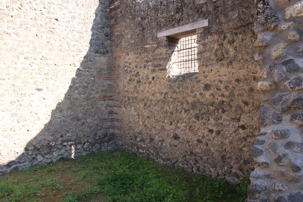 I.12.8 Pompeii. October 2022. Looking towards south-east corner and south wall with window. Photo courtesy of Klaus Heese.