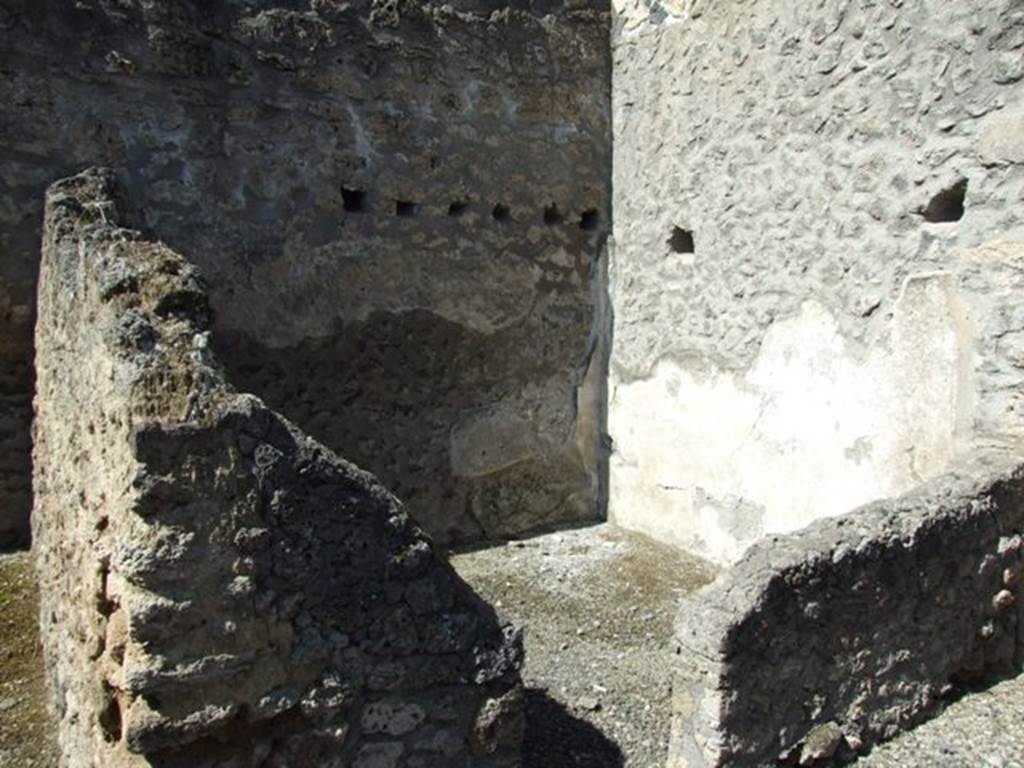 I.12.8 Pompeii.  March 2009.   Doorway to room 6 and north west corner.