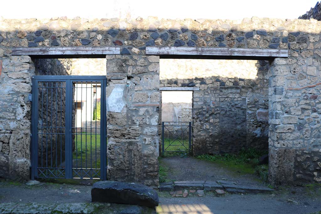 I.12.11 Pompeii, on left and I.12.10, on right. December 2018. Looking towards entrance doorways. Photo courtesy of Aude Durand.