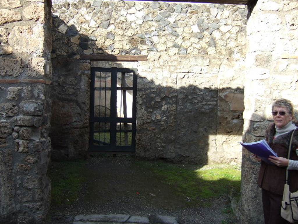 I.12.10 Pompeii. December 2005. Looking across shop to doorway in north wall.