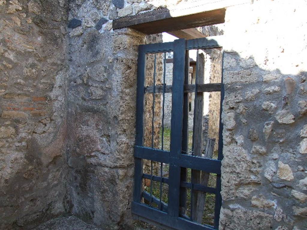 I.12.10 Pompeii. December 2006. Doorway in north wall of shop, to I.12.11