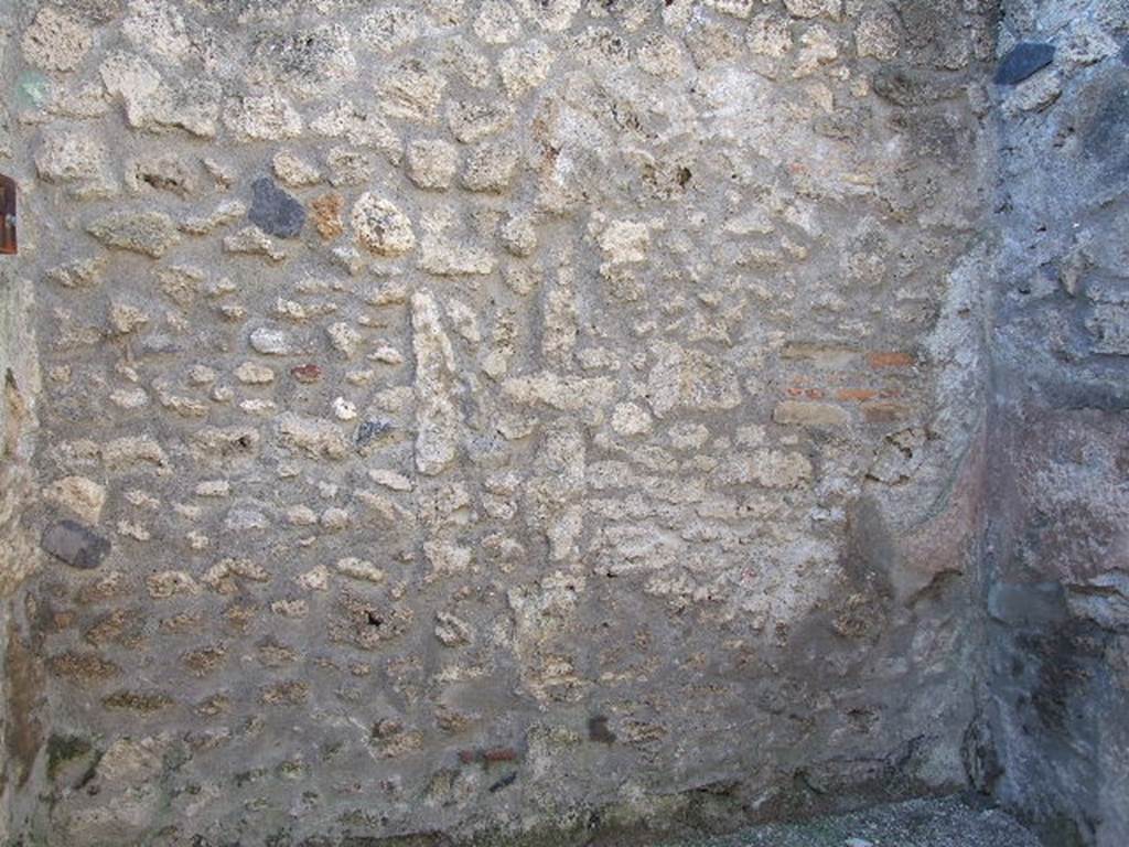 I.12.10 Pompeii. December 2006. West wall of shop.