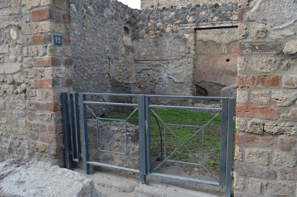 I.12.12 Pompeii. October 2017. Looking north-west through entrance doorway.
Foto Taylor Lauritsen, ERC Grant 681269 DCOR.
