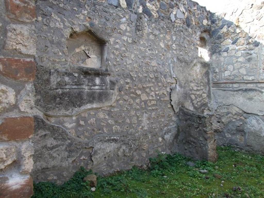 I.12.12 Pompeii. December 2007. West wall of shop.