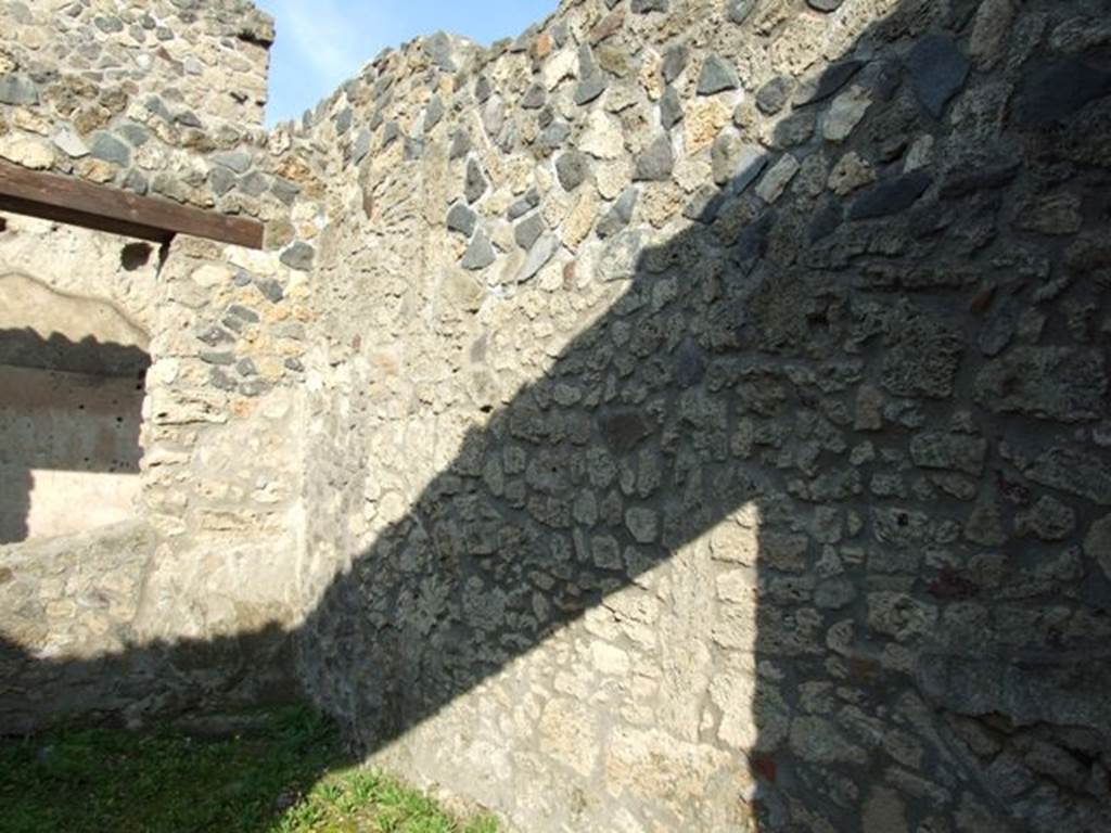 I.12.12 Pompeii. December 2007. East wall of shop.