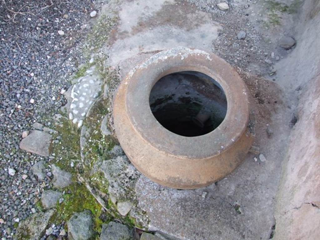 I.12.15 Pompeii. March 2009. Room 5, cistern opening with terracotta dolium being used as a puteal.