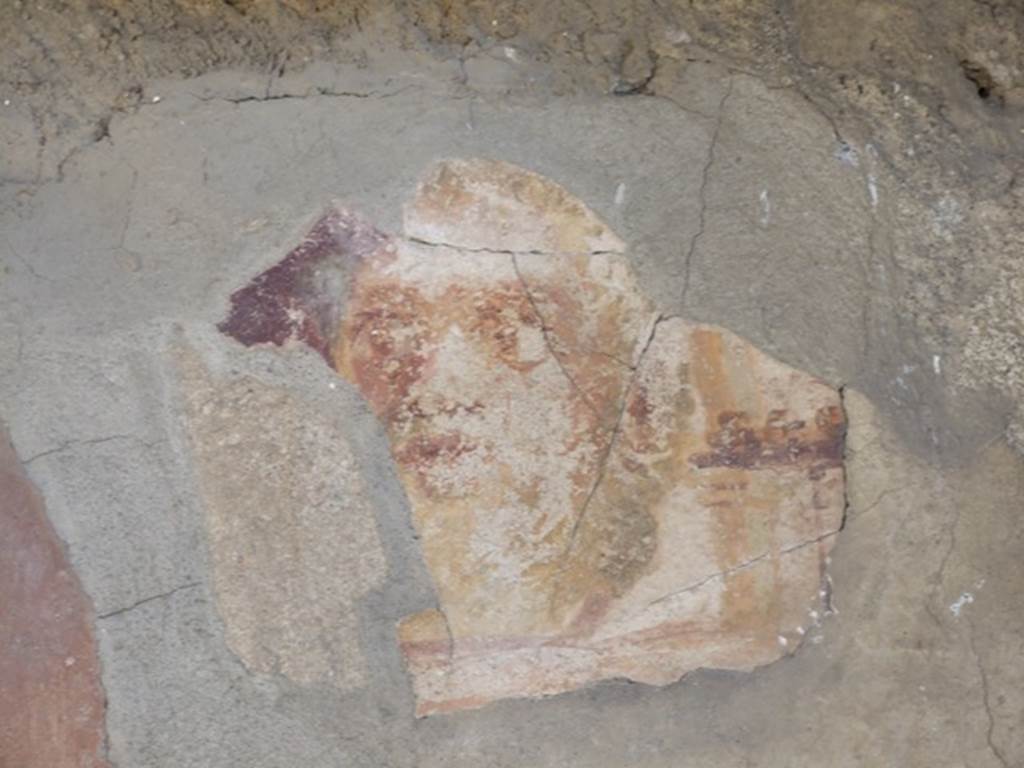 I.12.15 Pompeii.  March 2009.  Room 5, lararium with detail of the other face on the south side of the niche on the east wall.