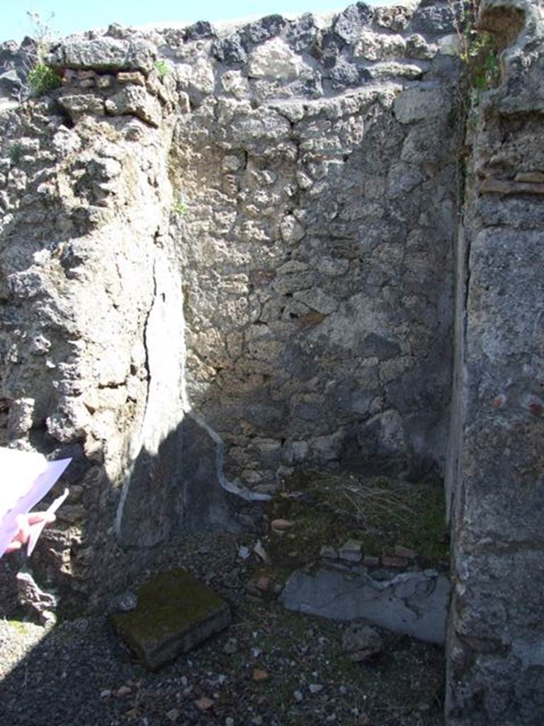 I.12.15 Pompeii.  March 2009.  East wall outside room 6.