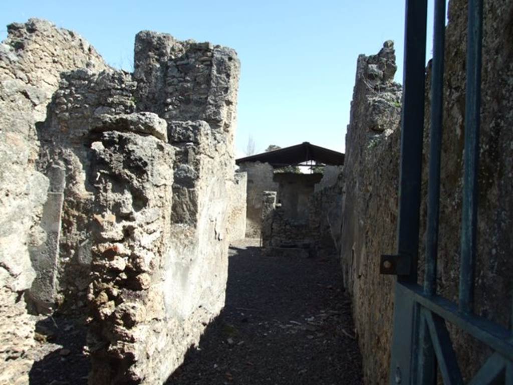 I.12.15 Pompeii. March 2009. Looking east along entrance fauces, towards room 1, the atrium.