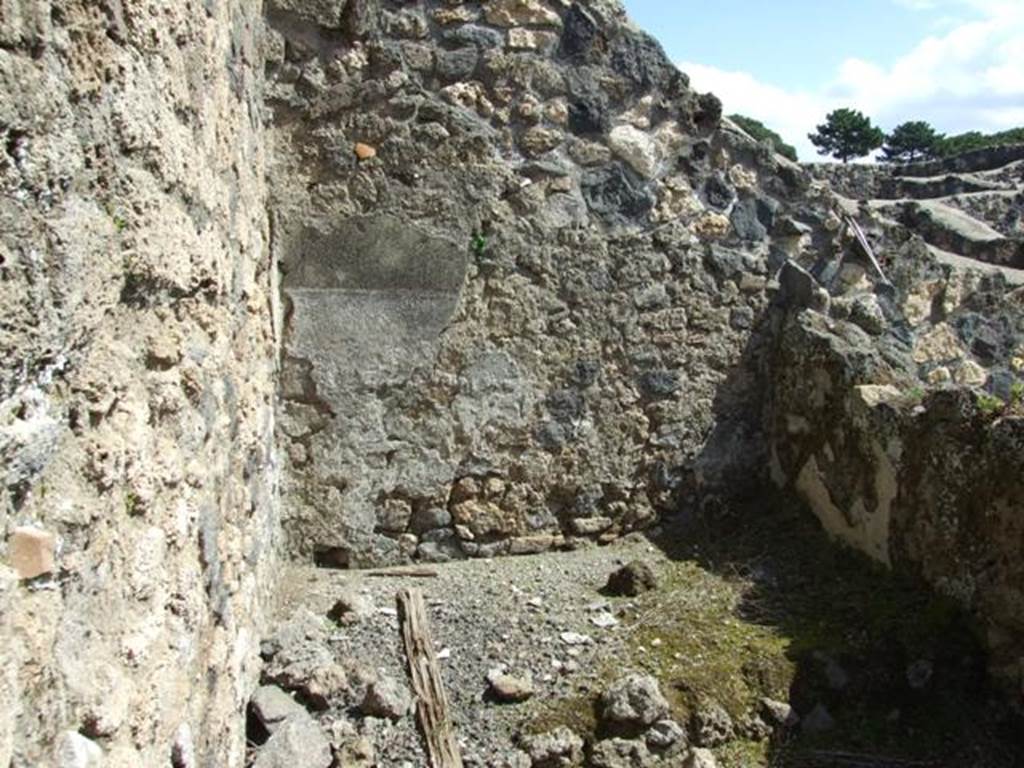 I.12.16 Pompeii. March 2009. Room 5, east end of kitchen, with remains of plaster on east wall above bench.