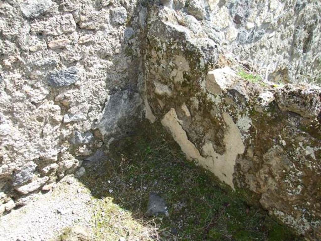 I.12.16 Pompeii. March 2009. Room 5, kitchen with remains of plaster in south-east corner above bench.