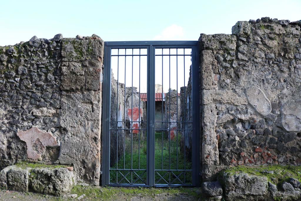 I.12.16 Pompeii. December 2018. Looking through entrance doorway. Photo courtesy of Aude Durand.