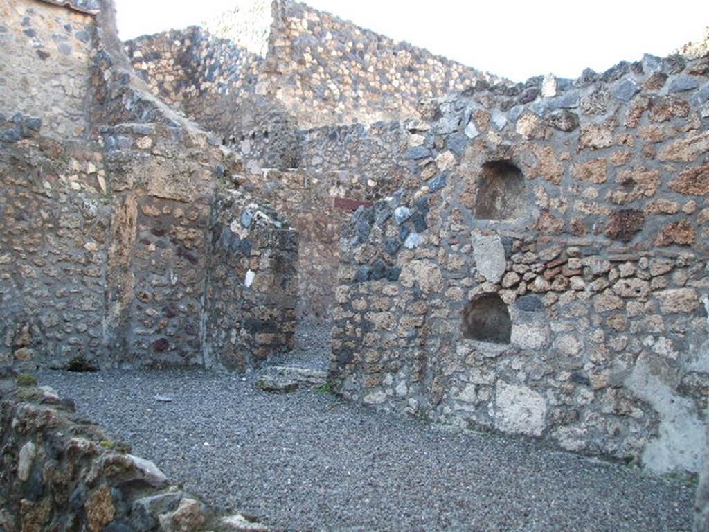 I.13.6 Pompeii. December 2004. Looking north-west across yard on north side of entrance