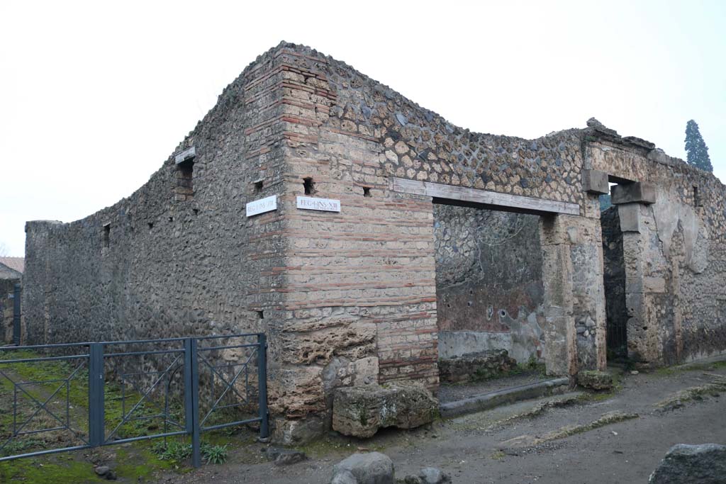 I.13.13, Pompeii, and I.13.12, on right. December 2018. 
Looking towards entrance doorways on north side of Via di Castricio. Photo courtesy of Aude Durand.

