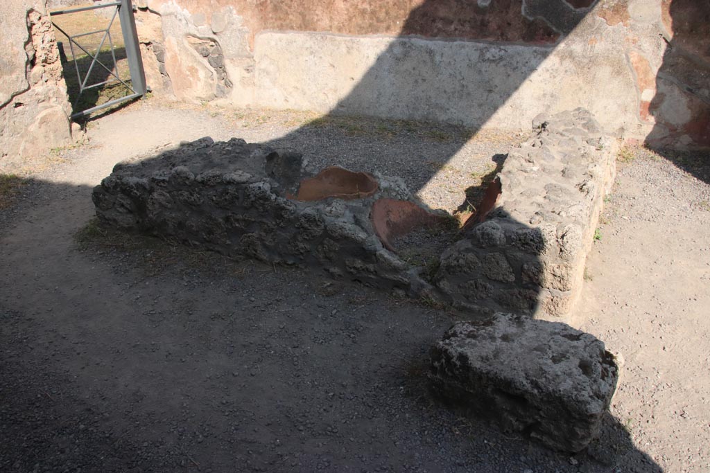 I.13.13 Pompeii. October 2023. Looking east across two-sided counter. Photo courtesy of Klaus Heese.