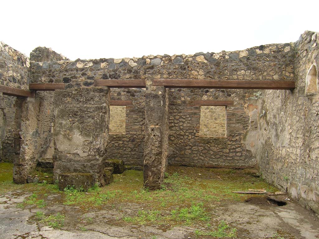 I.14.2 Pompeii. July 2008. Looking south across atrium to base of stairs (left) to upper floor. Photo courtesy of Guilhem Chapelin. 
The group of rooms aligned in the southern part of the house was surmounted by a floor. From the atrium, in fact, this level was reached thanks to a staircase leaning against the eastern wall of room D (Fig. 159). From this staircase remains only the start, constituted of two rough masonry steps (l .: 0,72 m). However, the traces that remain partially on the travertine blocks composing the wall indicate that a wooden staircase followed these two steps. In 1958, the excavators also reported the presence of charred wood at the bottom of the staircase, a probable remnant of this development (see Fig. 156).
Voir Chapitre 2 : Latelier de fabrication de nattes de la via di Nocera (I 14, 2) in Magali Cullin-Mingaud, 2010. La vannerie dans l'Antiquit romaine: Collection du Centre Jean Brard 35. Paris. Centre Jean Berard, p. 129-171, fig. 159, fig. 156.
https://books.openedition.org/pcjb/706
