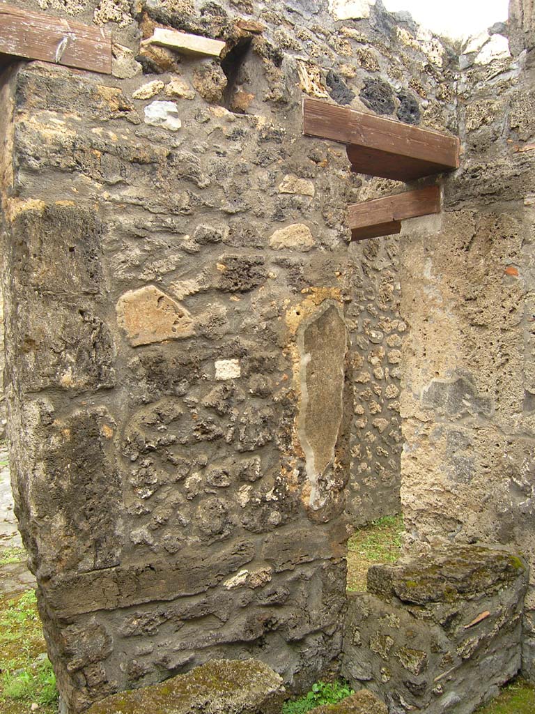 I.14.2 Pompeii. July 2008. Room E, north wall with start of stairs to upper floor, on right.
Photo courtesy of Guilhem Chapelin. 

