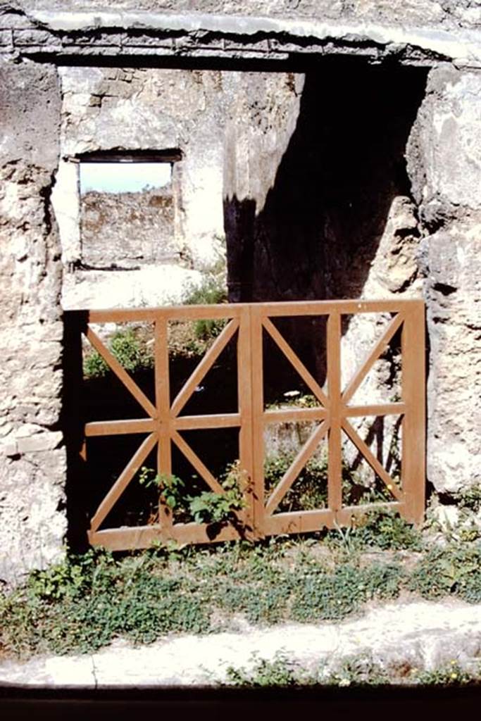 I.14.2 Pompeii. 1972. Looking west through entrance doorway. Photo by Stanley A. Jashemski. 
Source: The Wilhelmina and Stanley A. Jashemski archive in the University of Maryland Library, Special Collections (See collection page) and made available under the Creative Commons Attribution-Non Commercial License v.4. See Licence and use details. J72f0414
