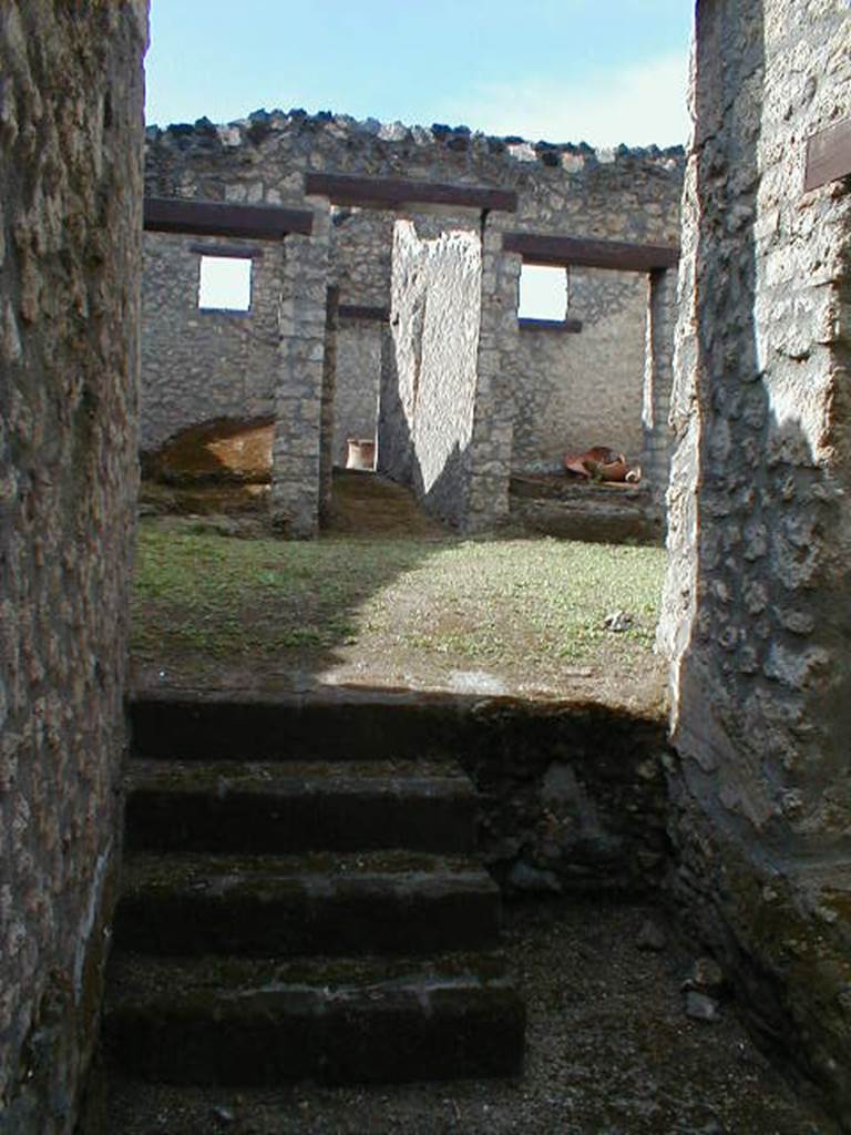 I.14.3 Pompeii. September 2004. Steps to atrium, looking west.