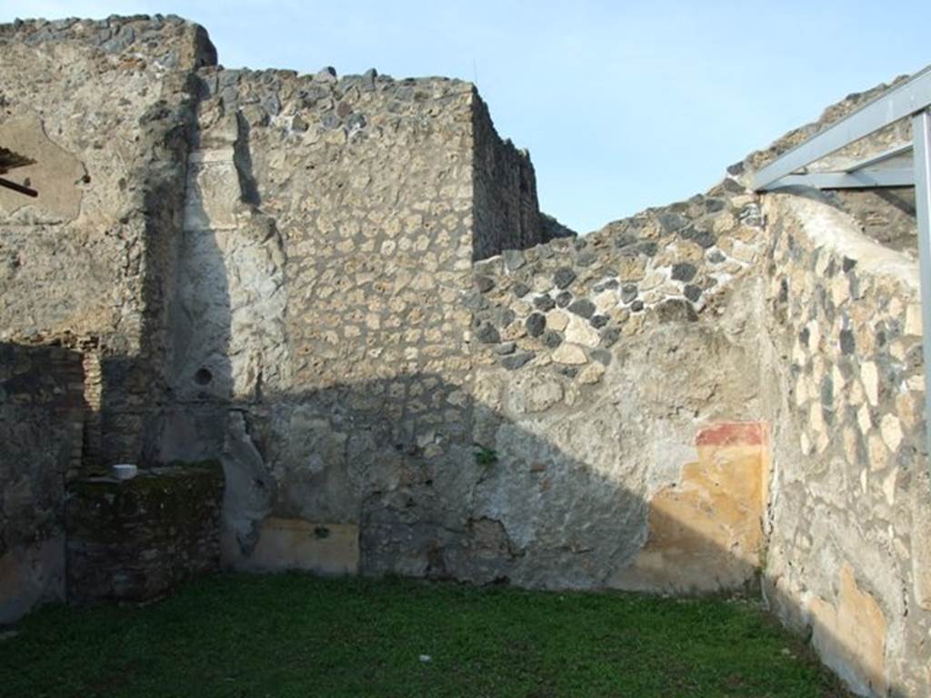 I.14.4 Pompeii.  House.  December 2007.  Room 5.  Room at west end of north wall.  Location of blocked door to I.14.5 in centre.