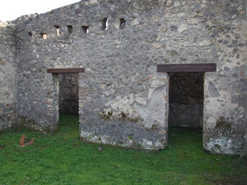 I.14.4 Pompeii. December 2007. Doorways to room 9 and room 8, the rooms at east end of south wall.  
