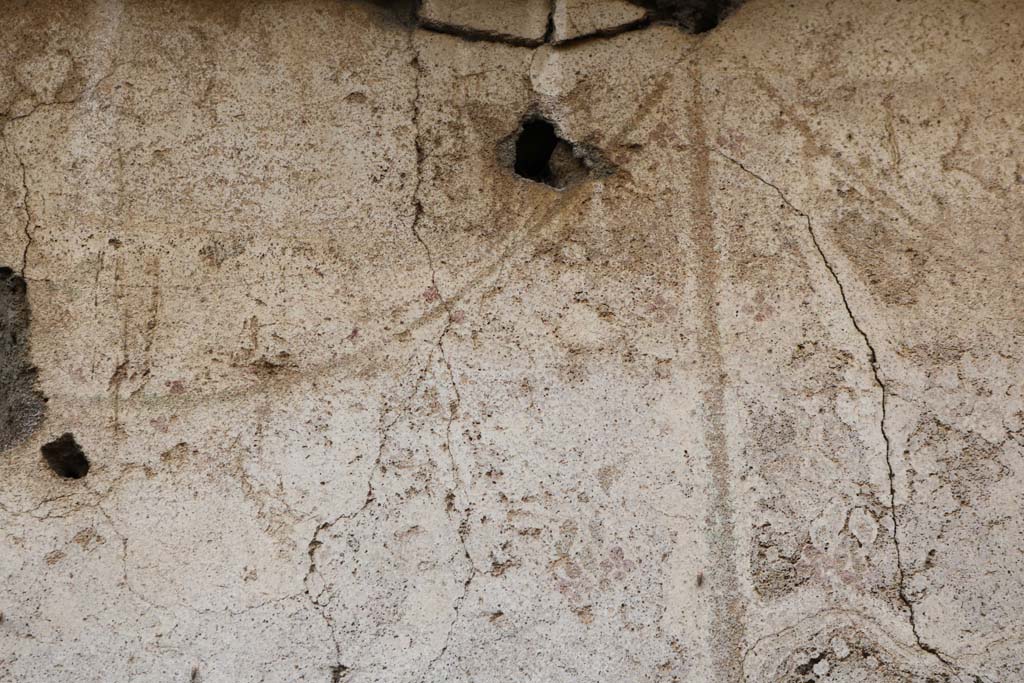 I.14.5 Pompeii. December 2018. Looking towards wall with detail of remaining painted decoration. Photo courtesy of Aude Durand.