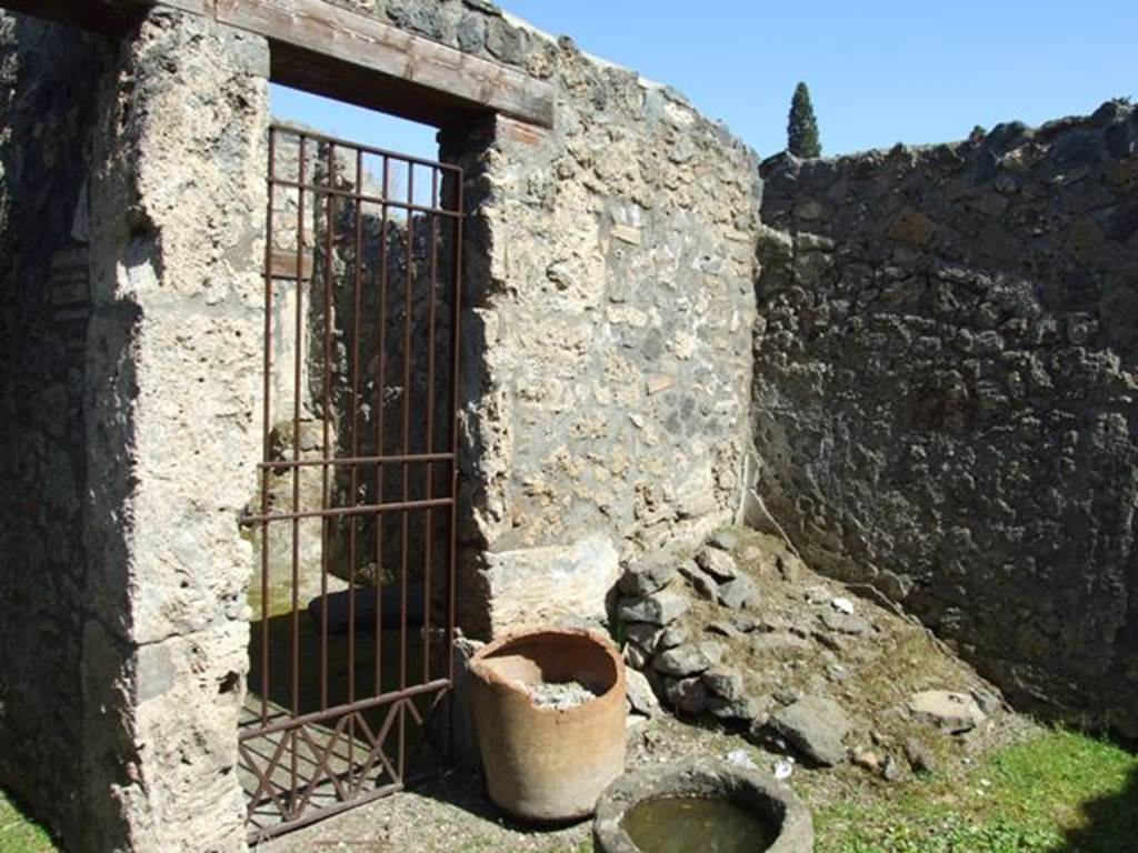 I.14.7 Pompeii.  March 2009.  North east corner of the atrium, with doorway into shop at I.14.6, and remains of steps to upper floor.