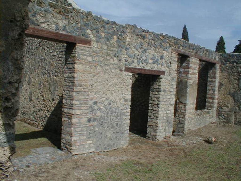 I.14.9 Pompeii. September 2004. Doorways to rooms on north side.