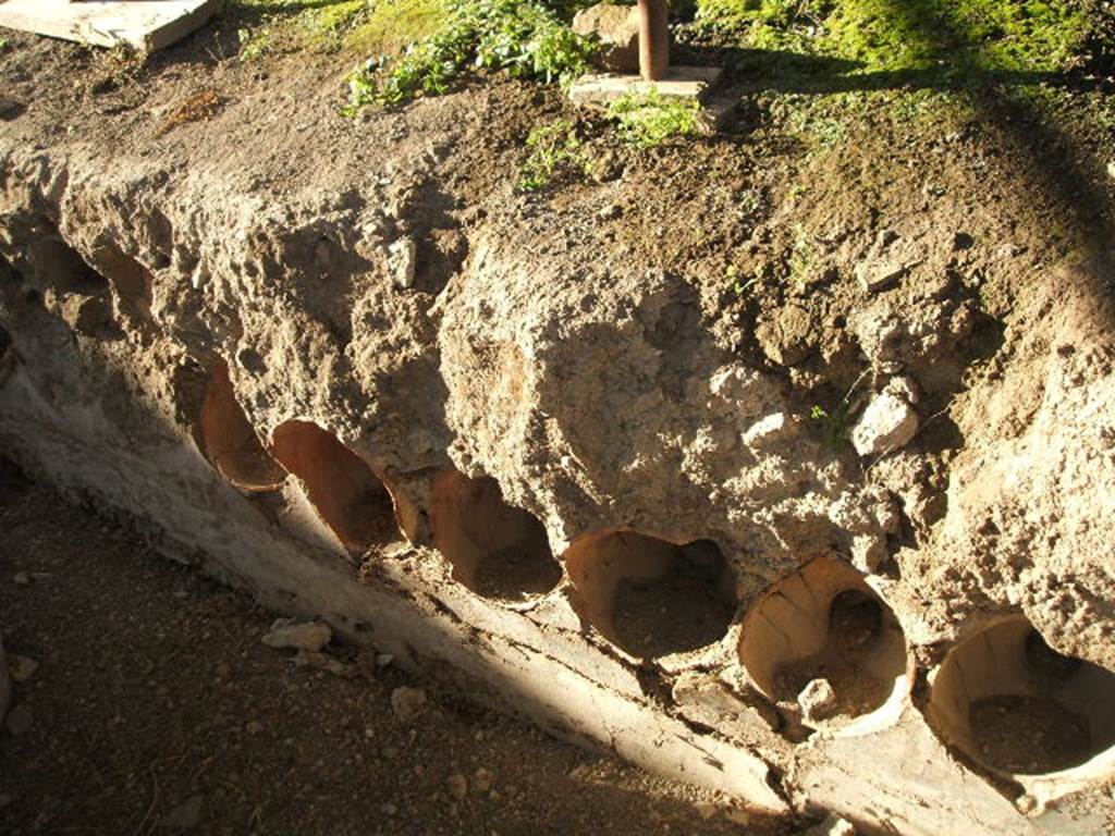 I.14.10 Pompeii.  December 2004.  Pots in side of Triclinium.