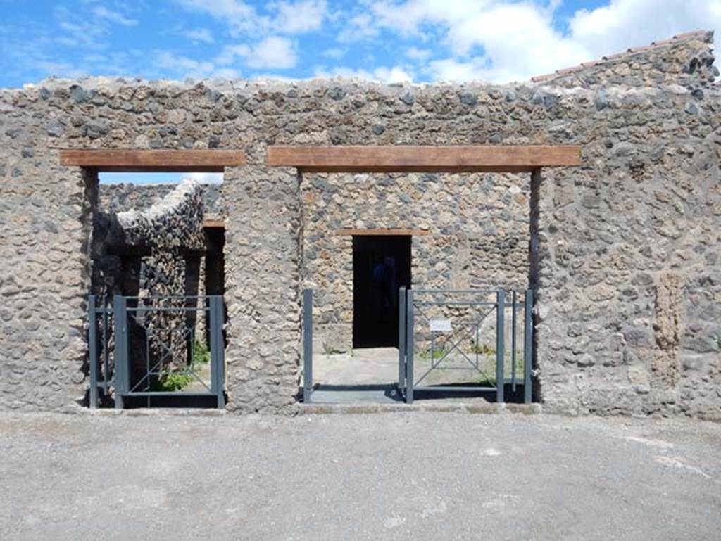 I.14.12, on left, and I.14.13, centre, Pompeii. May 2018. Looking north to entrance doorways. Photo courtesy of Buzz Ferebee.