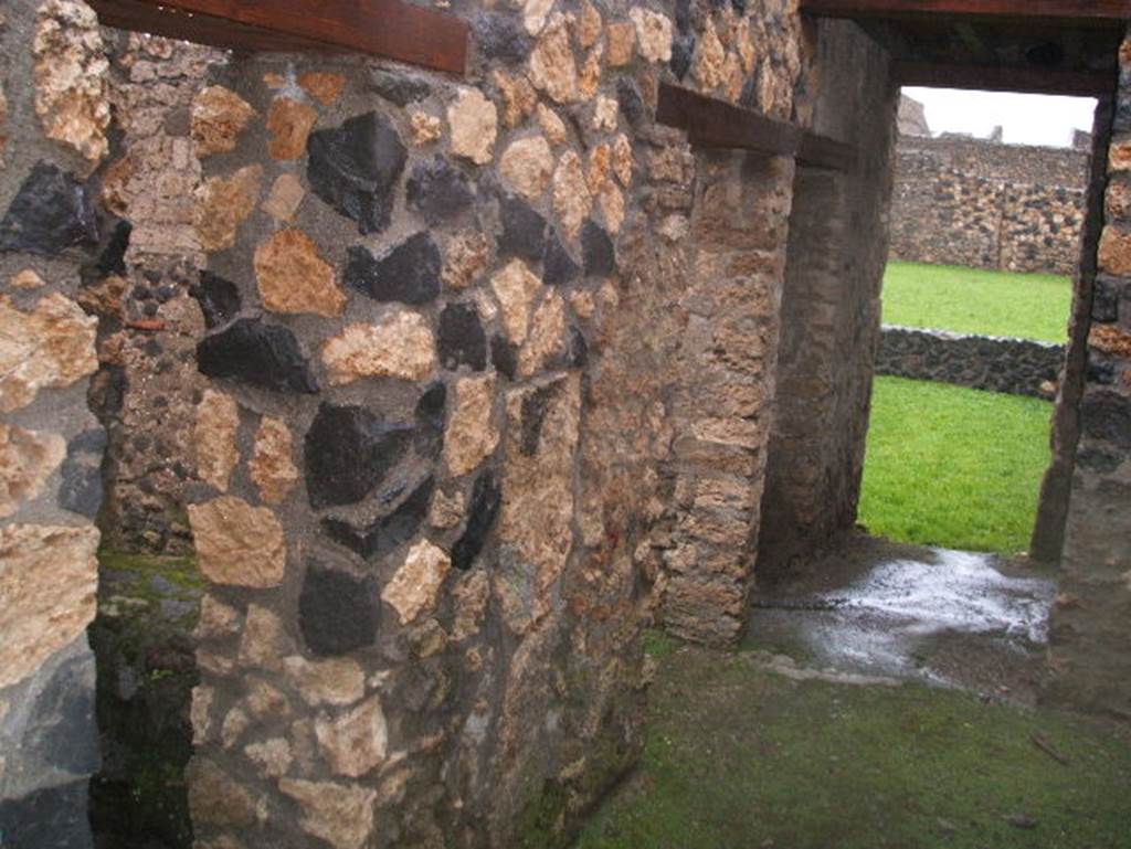 I.14.12 Pompeii. December 2004. West wall of fauces, with doorways linking to I.14.11.